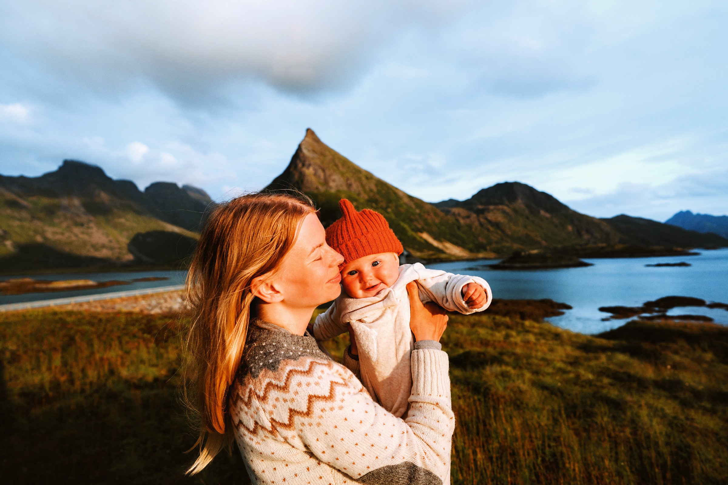 Mother and baby family traveling in mountains hiking healthy lifestyle mom and child together active vacations trip outdoor in Norway Mother and baby family traveling in mountains hiking healthy lifestyle mom and child together active vacations trip outdoor in Norway